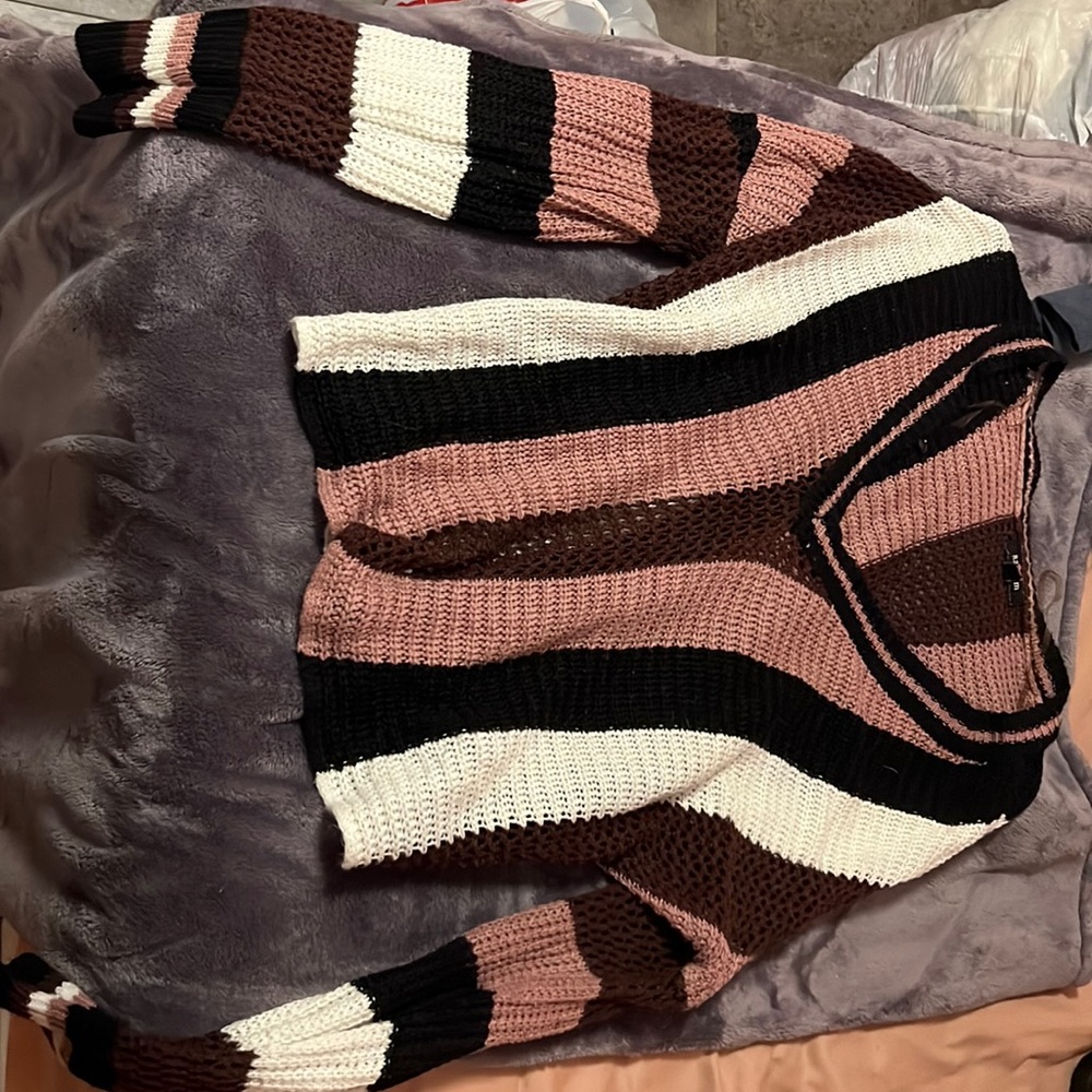 purples white and black sweater